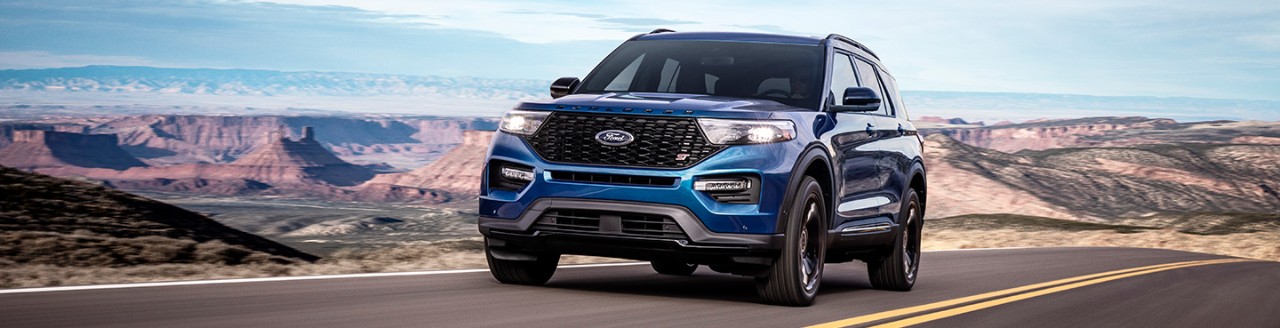 Blue Ford Explorer on mountain road