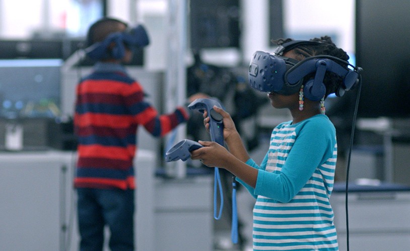 Image of kids playing with a VR set