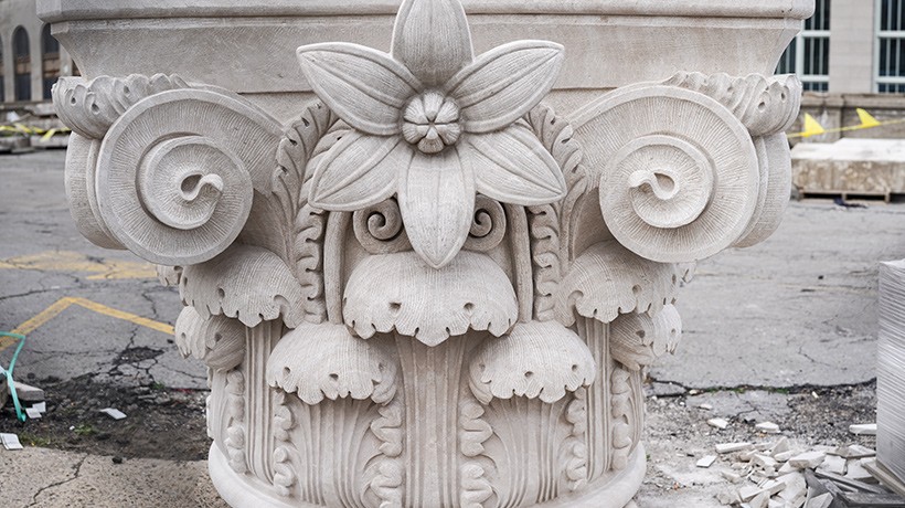 Ornamental column capitals are being restored.