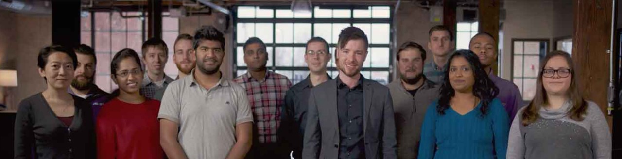 Group of colleagues pose for camera