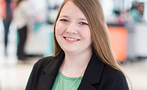 Female employee smiles for camera