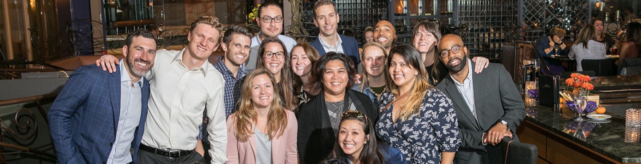 Group of well dressed coworkers in restaurant