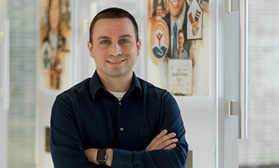 Male employee smiling for the camera