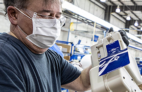 male worker holding part