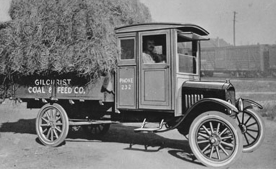 A black and white image of The Ford Model TT truck