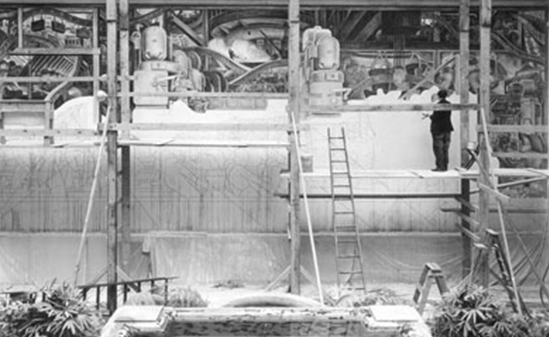 A painter painting a mural
