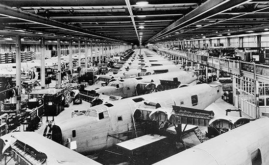 Black and white image of aircraft assembly line