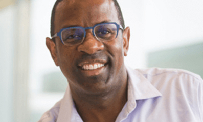 Male employee smiling for camera