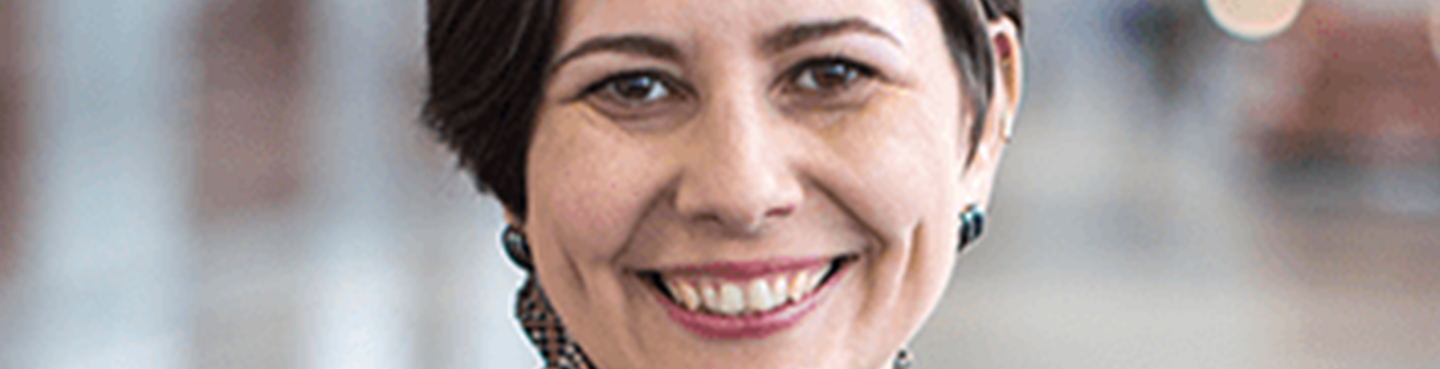 Female employee smiling for camera