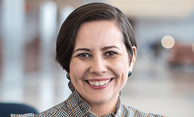 Female employee smiling for camera