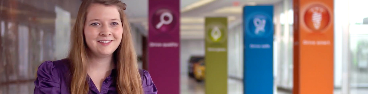 Female employee smiling for camera