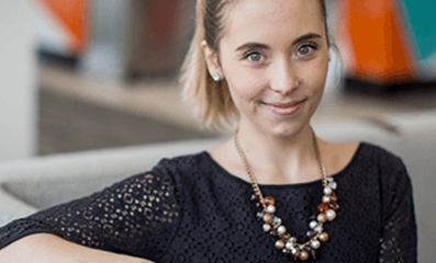 Female employee smiling for camera