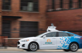 An autonomous vehicle driving down a street
