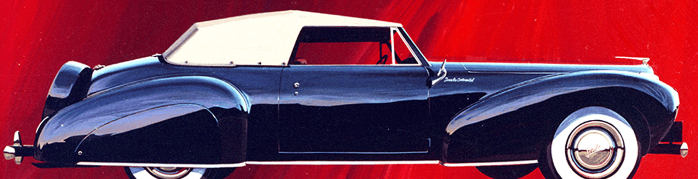historic original blue lincoln continental on red background