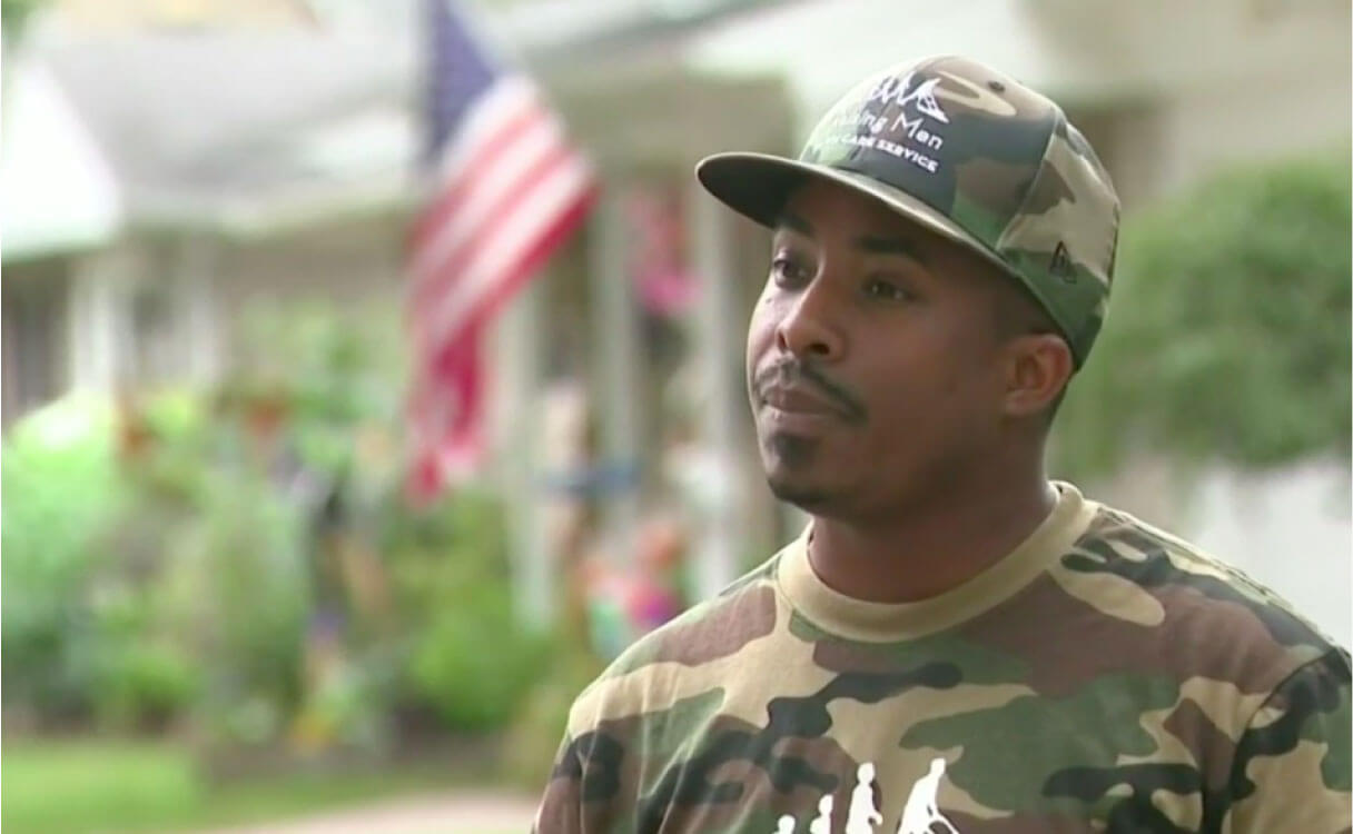 Man in camoflague cap and shirt
