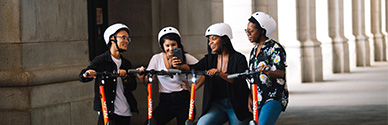 A group of people on SPIN scooters