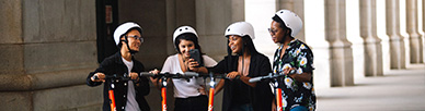 A group of people on SPIN scooters