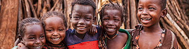A group of children standing together for a photo