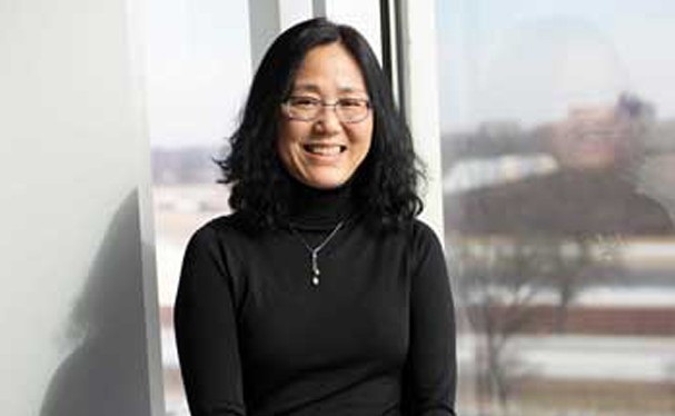 A photo of Bo Wu smiling at the camera