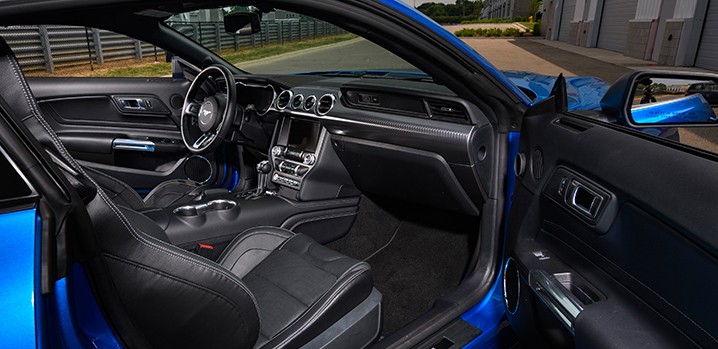 The front seats of a Mustang