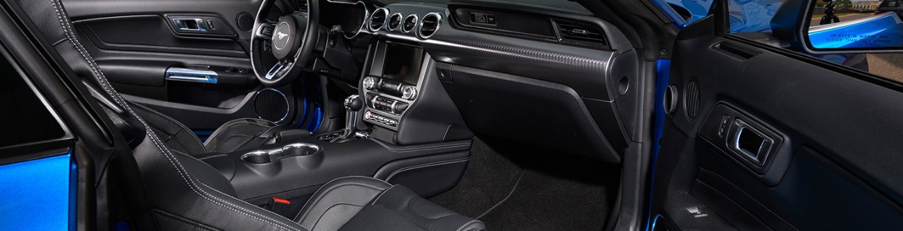 The front seats of a Mustang