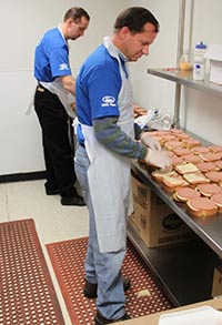 Ford volunteers make sandwiches.