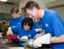 Volunteers serve meals at soup kitchen