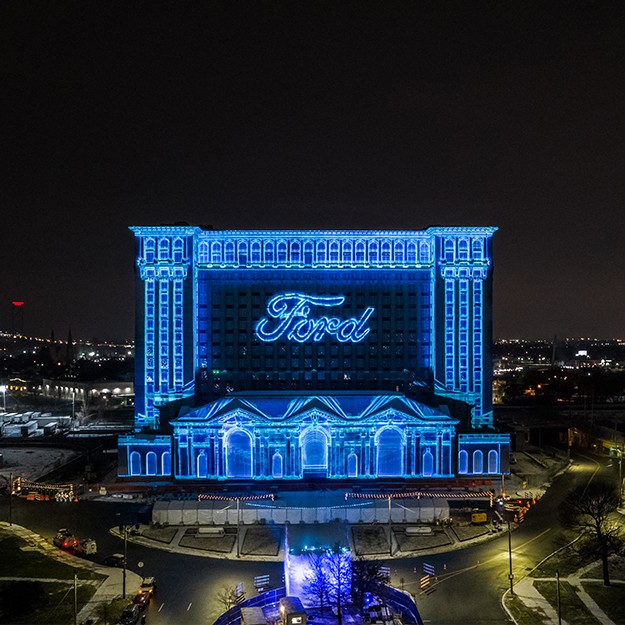 Michigan Central Station being lit up with the Ford logo