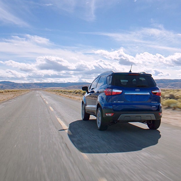 Ford vehicle driving on a road