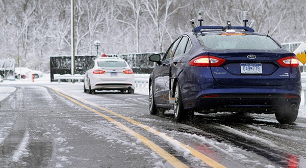 A Ford self-driving vehicle driving in the snow