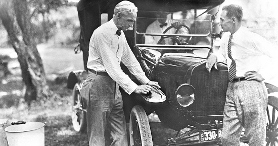 Edsel and Henry Ford in 1921 with Model T.