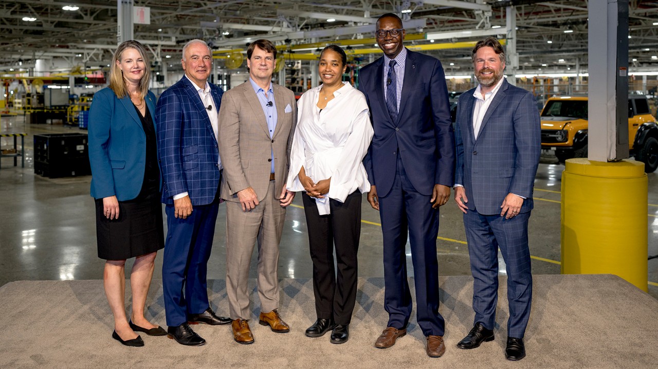 Farley with a group of employees