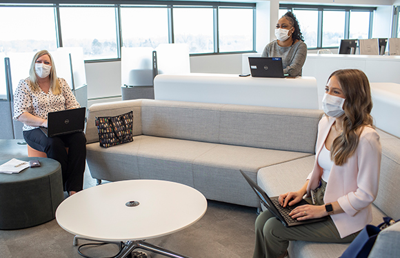 Three women sitting in office