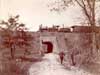 Image of: Boys on Bicycles with Train on Overpass Near Arlington, New Jersey