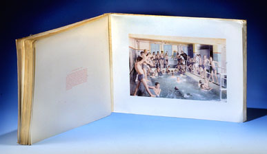 Image of souvenir viewbook open to picture of boys in swimming pool.