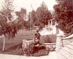 Image of: Man Drinking from Well at Lake Cottages, Wequetonsing, Michigan