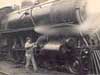 Image of: "Oiling Up Before the Start", Engineer Working on Michigan Central Railroad K Class Locomotive