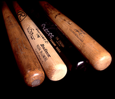 Baseball Bats: (Left to Right) Single-season record-breaking home run bats used by Babe Ruth, Mark McGuire, Sammy Sosa and Roger Maris. National Baseball Hall of Fame, Cooperstown, New York