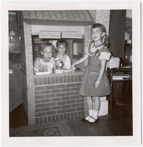 Three girls at their Free Parking/Lemonade stand.